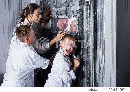 Mother with childred are helping dad and girl get out of the locked door Mother with childred are helping dad and girl get out of the locked door 103944304