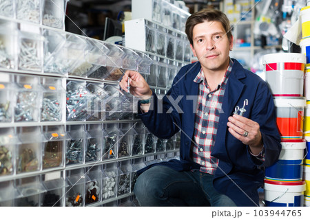 Portrait of customer in hardware store choosing goods for repair 103944765
