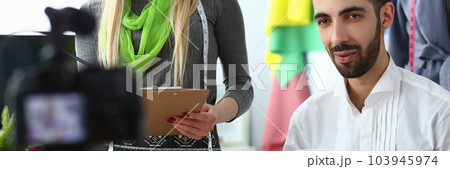 Bloggers, designers stylists record videos on camera on choice and combination of colors and shades in clothes Bloggers, designers stylists record videos on camera on choice and combination of colors and shades in clothes 103945974