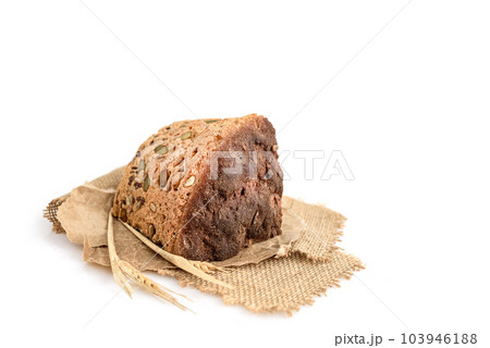 A slice of homemade grain bread on white 103946188