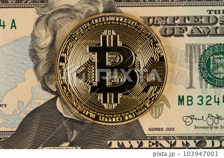 Golden bitcoin coin on dollar Golden bitcoin coin on dollar 103947001
