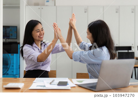 Happy asian business people employee celebrating while reading email good news. business account and finance 103947270