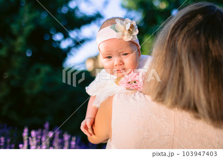 Portrait of baby girl with her mother in outdoor Portrait of baby girl with her mother in outdoor 103947403