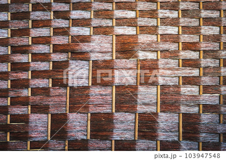 Traditional wickerwork made from natural wood straw products, mat background 103947548