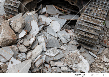 Backhoe wheel on demolition site Backhoe wheel on demolition site 103950048