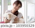 Young Asian smiling woman with her dog chihuahua at home. 103950329