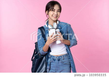 Portrait of young Asian woman student standing with smartphone coffee and backpack.College Teenager University concept. 103950335