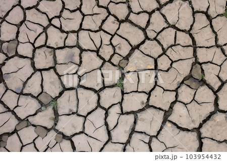 Crack. Dry soil. The global shortage of water on the planet. Global warming and greenhouse effect concept. The parched soil. Baraje. Soil drought cracked texture. 103954432