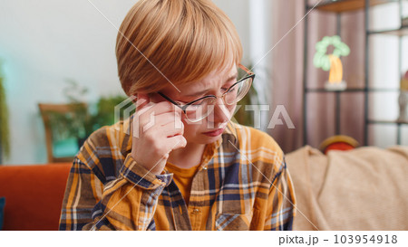 Upset disappointed young woman wipes tears and cries from despair, unrequited love, problems at home Upset disappointed young woman wipes tears and cries from despair, unrequited love, problems at home 103954918