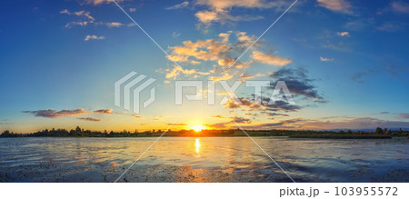 Calm sunrise on a lake Calm sunrise on a lake 103955572