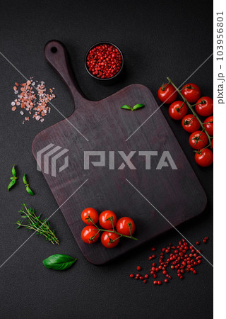 Ingredients for cooking cherry tomatoes, salt, spices and herbs Ingredients for cooking cherry tomatoes, salt, spices and herbs 103956801