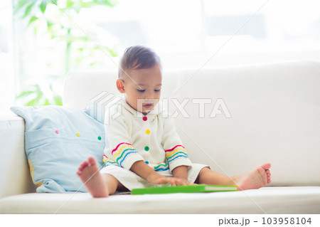 Baby boy reading a book. Kids read. 103958104