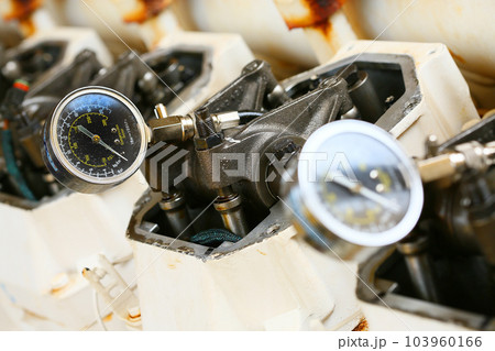 model of a vehicle engine, engine exhaust valve and intake valve, spring valve of the engine and auto spare parts, machine parts damaged from work. 103960166