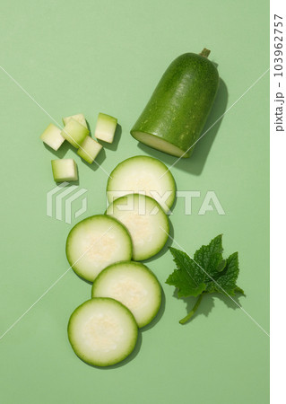 Several cubes and slices of winter melon are displayed. Winter melon (Benincasa hispida) is rich in minerals, amino acids, organic acids, natural sugars, and vitamins 103962757