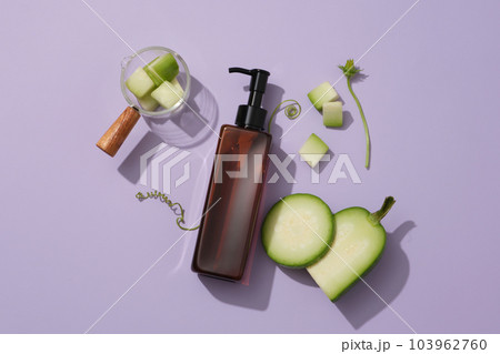 Flat lay of a pump bottle with winter melon slices. Cosmetic package mock up collection for cream, foams, shampoo extracted from Winter melon (Benincasa hispida) 103962760