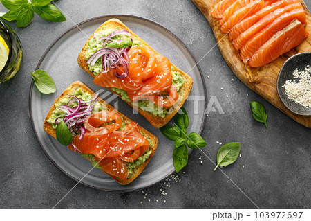 Sandwiches with salted salmon. Healthy food, breakfast. Top view Sandwiches with salted salmon. Healthy food, breakfast. Top view 103972697