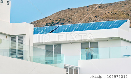 Solar panels on a house roof in Spain 103973012