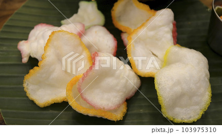 shrimp crisp or prawn chips or traditional fish crackers from asia. Indonesian food called Kerupuk. shrimp crisp or prawn chips or traditional fish crackers from asia. Indonesian food called Kerupuk. 103975310