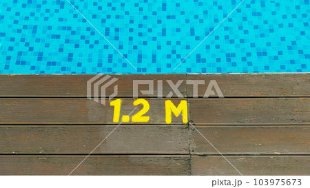 Deck of swimming pool edge 1.2 meter deep sign. Deck of swimming pool edge 1.2 meter deep sign. 103975673