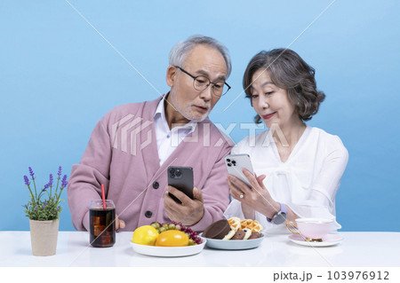 active young senior korean asian couple having teatime 103976912