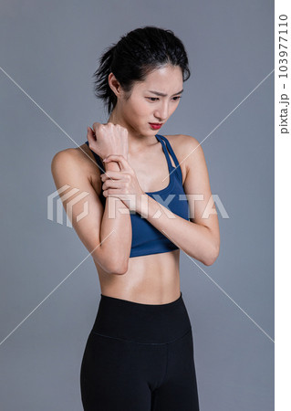 healthy beauty concept photo of korean asian beautiful woman feeling wrist pain healthy beauty concept photo of korean asian beautiful woman feeling wrist pain 103977110