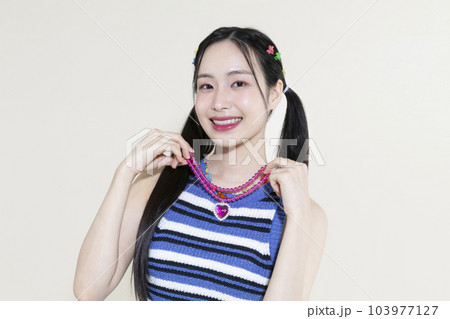 vintage y2k pink retro concept photo of korean asian cute woman wearing a necklace 103977127