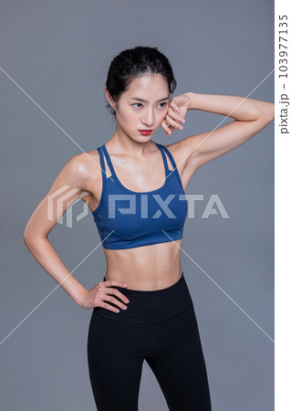 healthy beauty concept photo of korean asian beautiful woman wiping the sweat healthy beauty concept photo of korean asian beautiful woman wiping the sweat 103977135