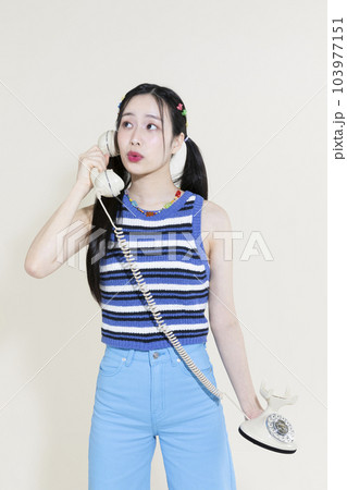 vintage y2k pink retro concept photo of korean asian cute woman calling 103977151
