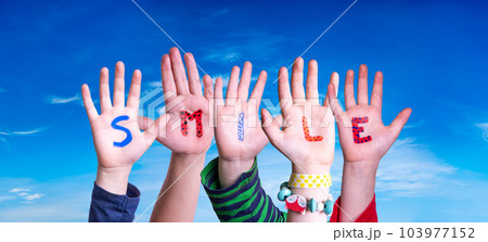 Children Hands Building Word Smile, Blue Sky 103977152