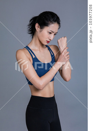 healthy beauty concept photo of korean asian beautiful woman feeling wrist pain healthy beauty concept photo of korean asian beautiful woman feeling wrist pain 103977208