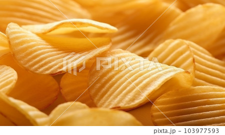 Delicious crispy potato chips, famous snack, fat food, wallpaper, texture, for banner, flyer 103977593