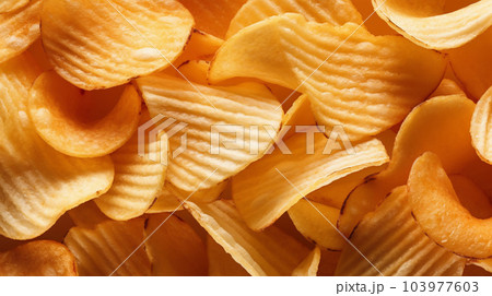 Delicious crispy potato chips, famous snack, fat food, wallpaper, texture, for banner, flyer 103977603