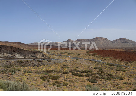 Panoramic view of volcanic lanscape in front of the ocean from the peak of mountain Teide, Tenerife Panoramic view of volcanic lanscape in front of the ocean from the peak of mountain Teide, Tenerife 103978334