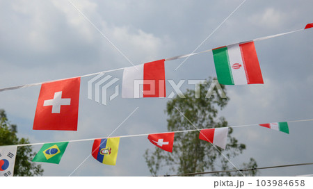 various country flags on blue sky background various country flags on blue sky background 103984658