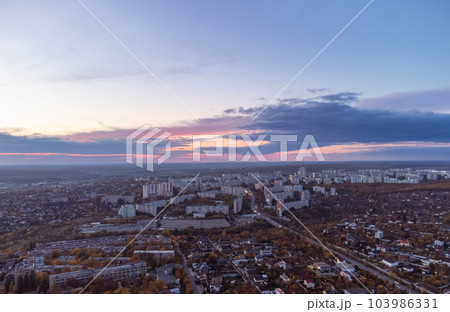 Aerial autumn sunset city view with scenic sky Aerial autumn sunset city view with scenic sky 103986331