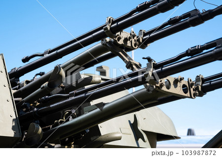 Heavy machine gun on a military vehicle, modern military equipment 103987872