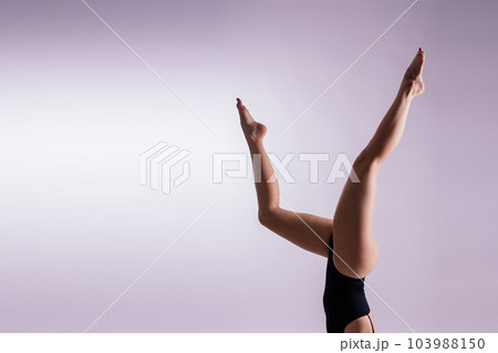 Beautiful woman doing poses on yoga class. Studio shot. Beautiful woman doing poses on yoga class. Studio shot. 103988150
