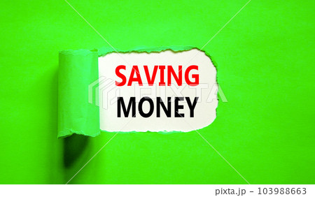 Saving money symbol. Concept words Saving money on beautiful white paper on a beautiful green background. Business, support and saving money concept. Copy space. 103988663