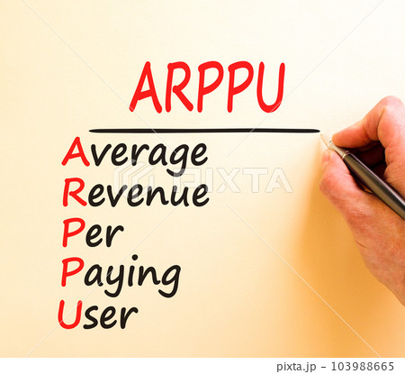 ARPPU average revenue per paying user symbol. Concept words ARPPU average revenue per paying user on white paper. Beautiful brown background. Business ARPPU average revenue per paying user concept. 103988665