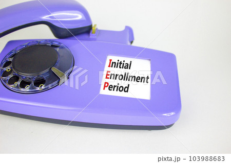 IEP symbol. Concept words IEP Initial enrollment period on beautiful old disk phone. Beautiful white table white background. Medical and IEP Initial enrollment period concept. Copy space. IEP symbol. Concept words IEP Initial enrollment period on beautiful old disk phone. Beautiful white table white background. Medical and IEP Initial enrollment period concept. Copy space. 103988683
