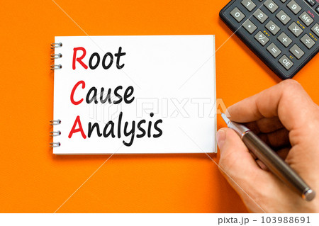RCA root cause analysis symbol. Concept words RCA root cause analysis on white note. Businessman hand. Beautiful orange table orange background. Business RCA root cause analysis concept. Copy space. RCA root cause analysis symbol. Concept words RCA root cause analysis on white note. Businessman hand. Beautiful orange table orange background. Business RCA root cause analysis concept. Copy space. 103988691