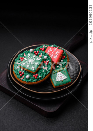 Delicious fresh sweet Christmas gingerbread with festive ornaments 103990135