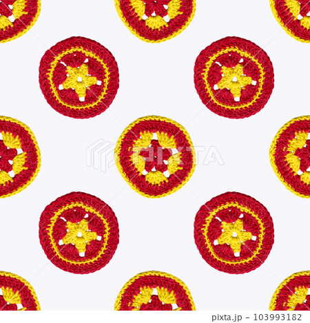 Decorative composition of multicolored knitted circles. Handmade patterns. Seamless pattern on white background 103993182