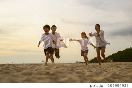 Happy family spending vacation time together on beach, Family with beach travel Happy family spending vacation time together on beach, Family with beach travel 103994935