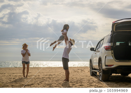 Happy Asian family travel on beach on holiday Happy Asian family travel on beach on holiday 103994969