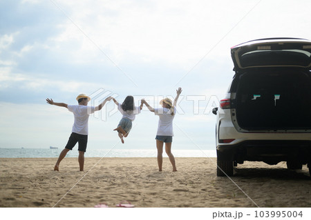 Happy Asian family travel on beach on holiday Happy Asian family travel on beach on holiday 103995004