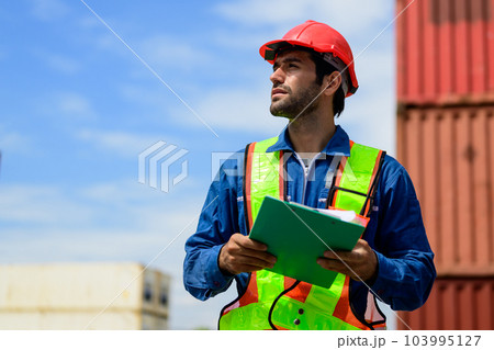 Warehouse engineer worker working at industrial container yard Warehouse engineer worker working at industrial container yard 103995127