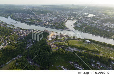 Wide Aerial Drone Shot of Ehrenbreitstein Fortress on the river rhine in Koblenz in evening, Rheinland-Pfalz, Germany 103995151