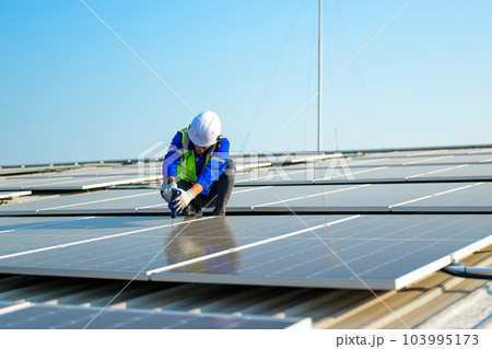 Professional engineer technician with safety helmet checking system Professional engineer technician with safety helmet checking system 103995173