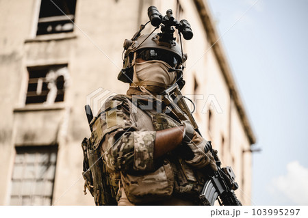 Expert team of soldiers attacking enemy during military operation Expert team of soldiers attacking enemy during military operation 103995297